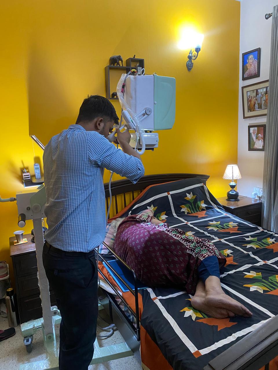 Closer angle of in-home X-ray procedure with portable unit